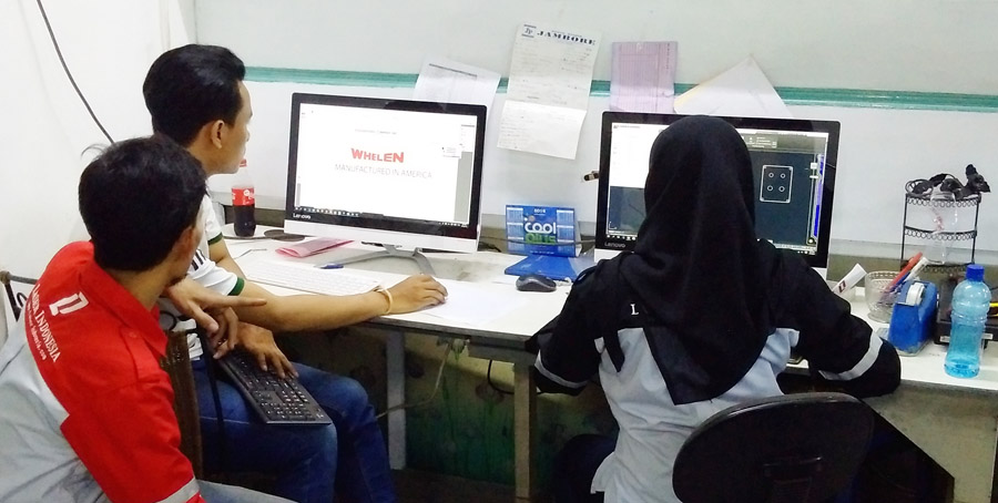 The Laser Indonesia team, relaxed at work preparign files to be cut